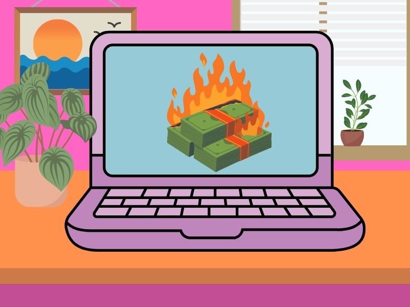 Computer with picture of burning money on screen